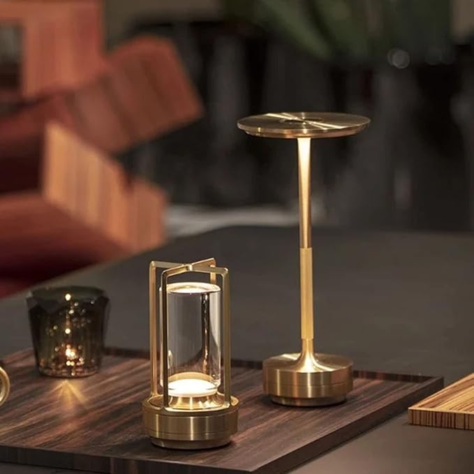 Aura Table Lamp gold finish cordless lamp with warm metallic glow on white