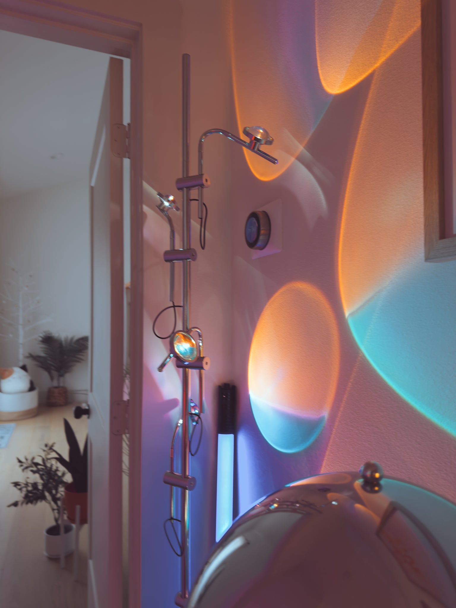 Polynescence Floor Lamp illuminated arms casting colored light beams