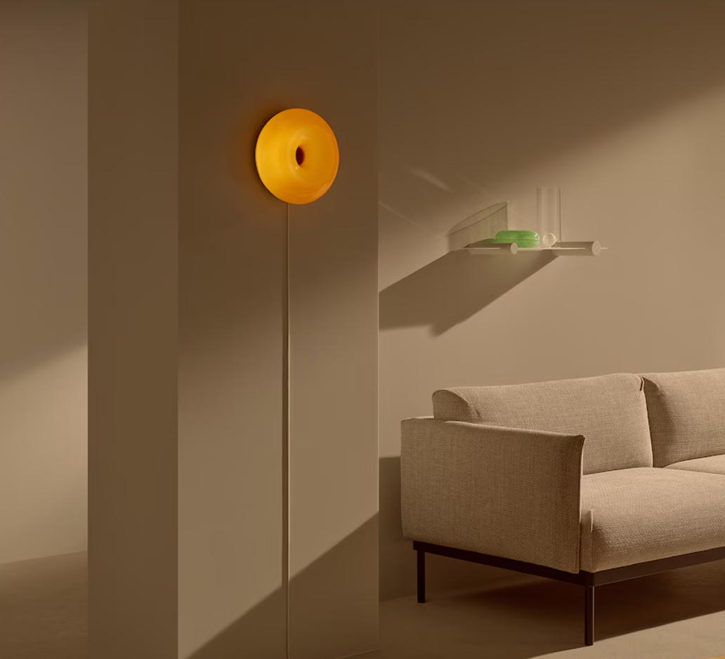 Glownut Lamp orange on accent shelf in styled home décor setting
