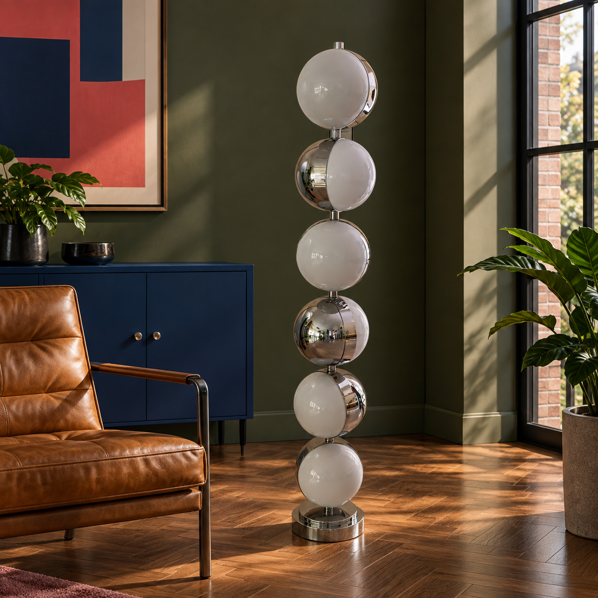 Caviar floor lamp in an olive loft with blue cabinetry and cognac leather.