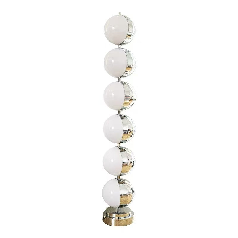 Caviar floor lamp with six milky white globe fronts, chrome housings and a round base.