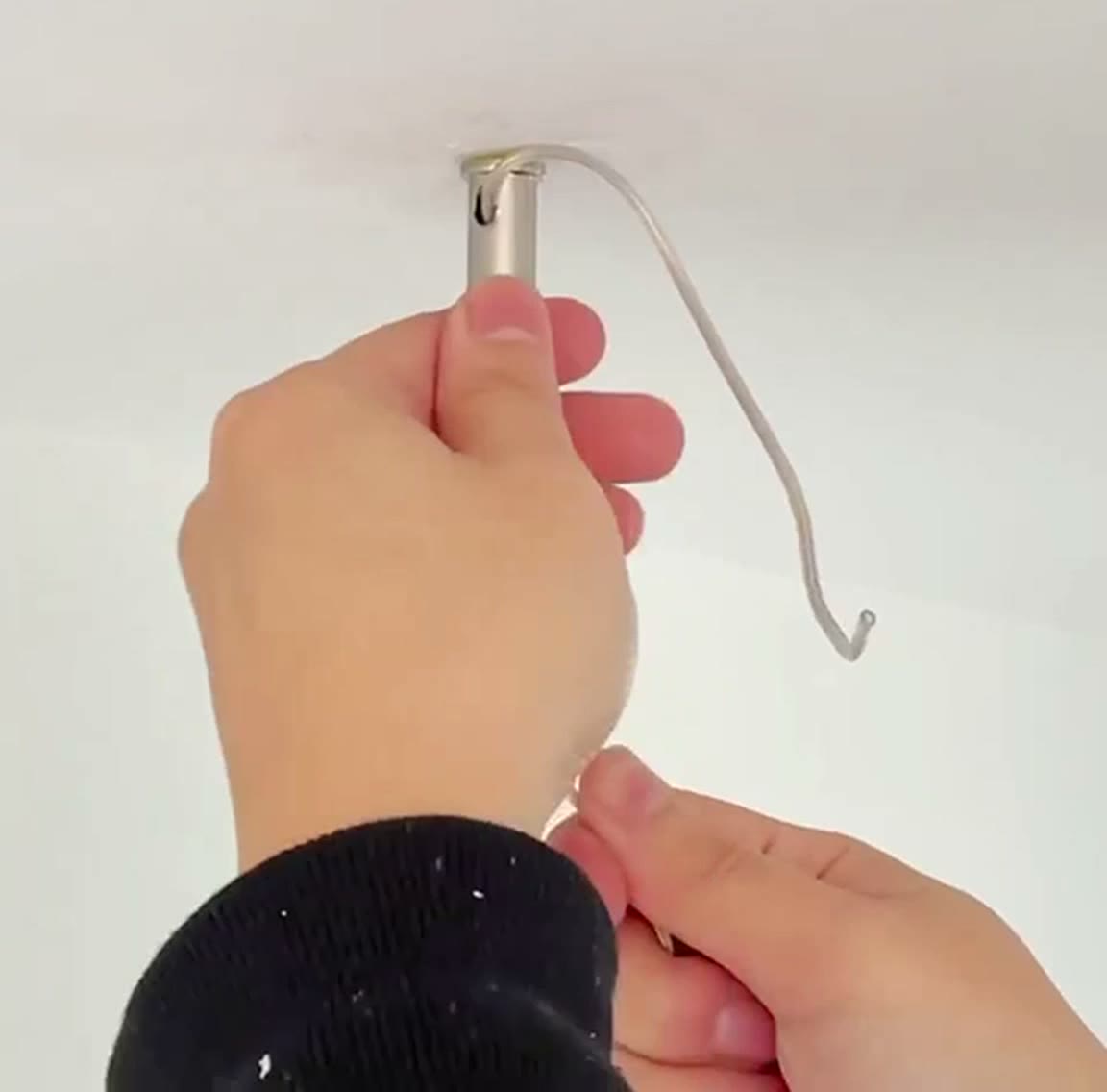Cable fed up into the ceiling fitting and out of the side slot