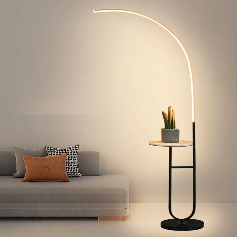 Crescenté Arc Floor Lamp sculptural chrome arc silhouette against dark wall