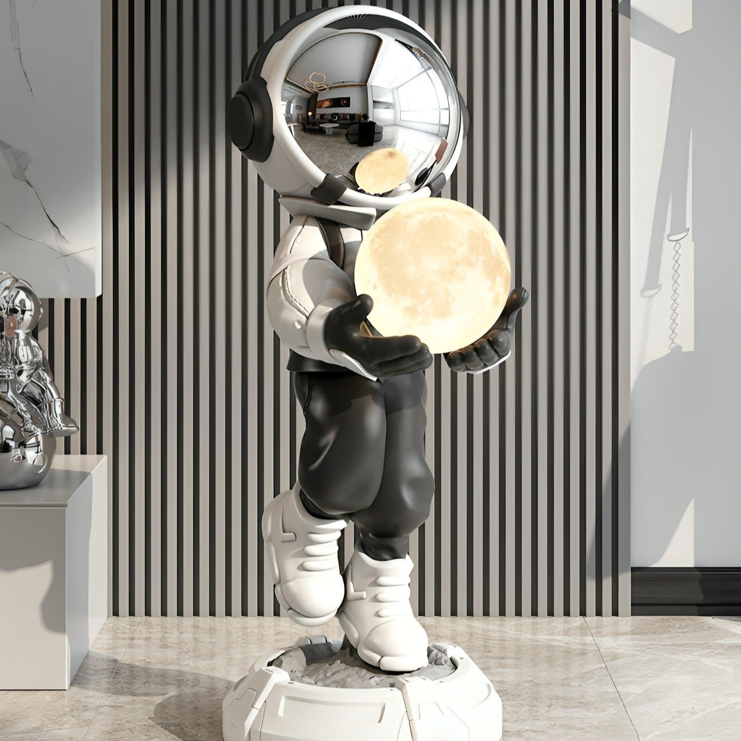Astro Lamp silver astronaut and moon sculptural LED table lamp by La Caza Cali