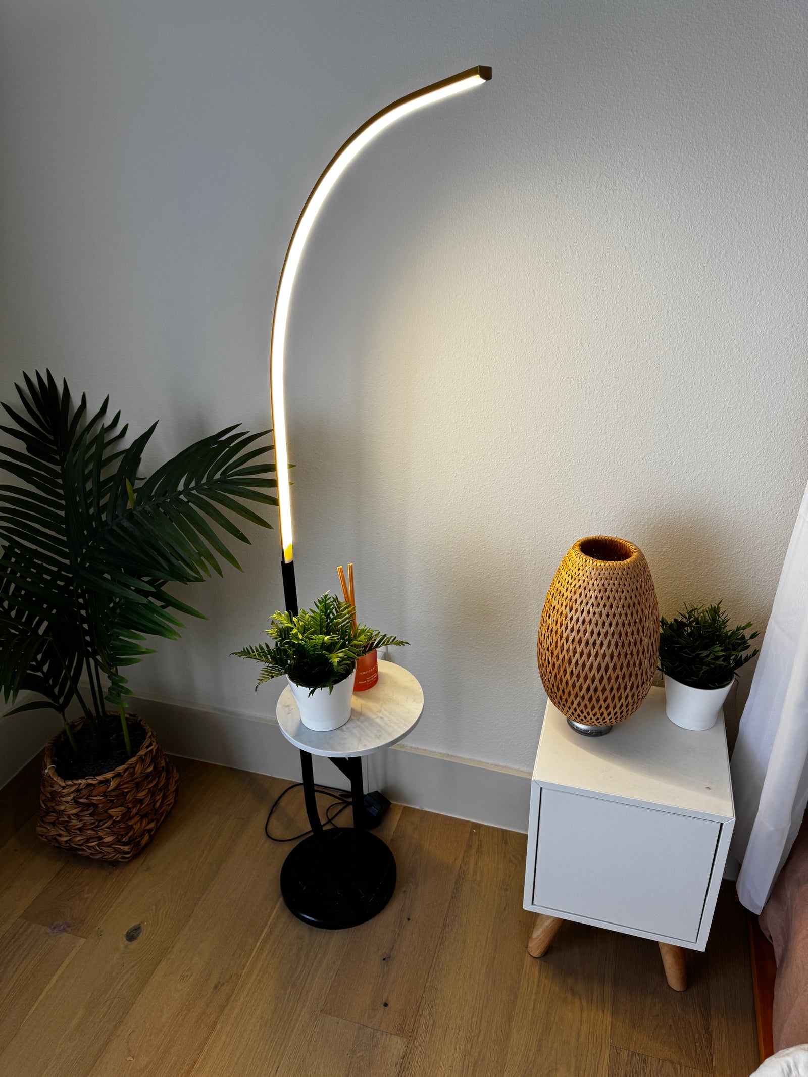 Crescenté Arc Floor Lamp showing sculptural chrome arc curve from below