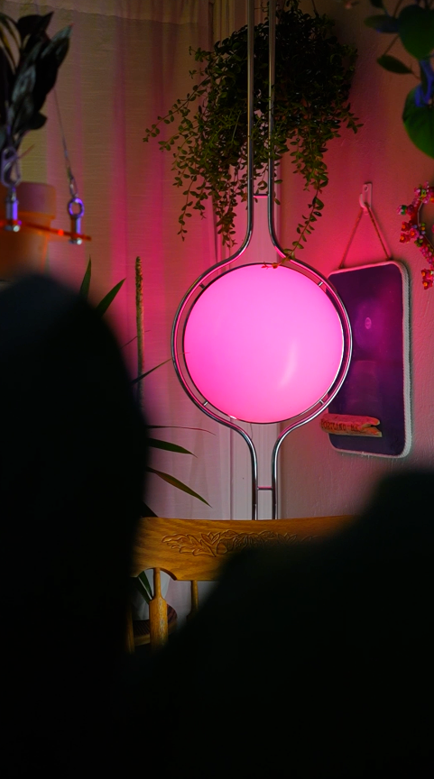 Pluto Floor To Ceiling Lamp styled in modern apartment with city view