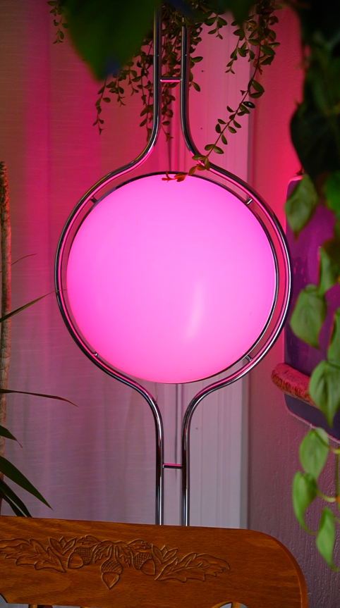 Pluto Floor To Ceiling Lamp in modern living room with globe lights at varied heights