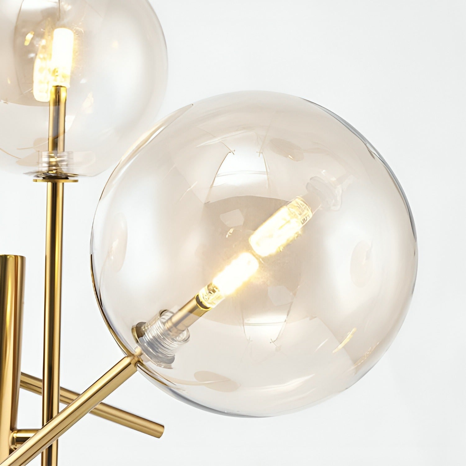 Golden Branch Floor Lamp close-up of gold branch arms meeting at central stem