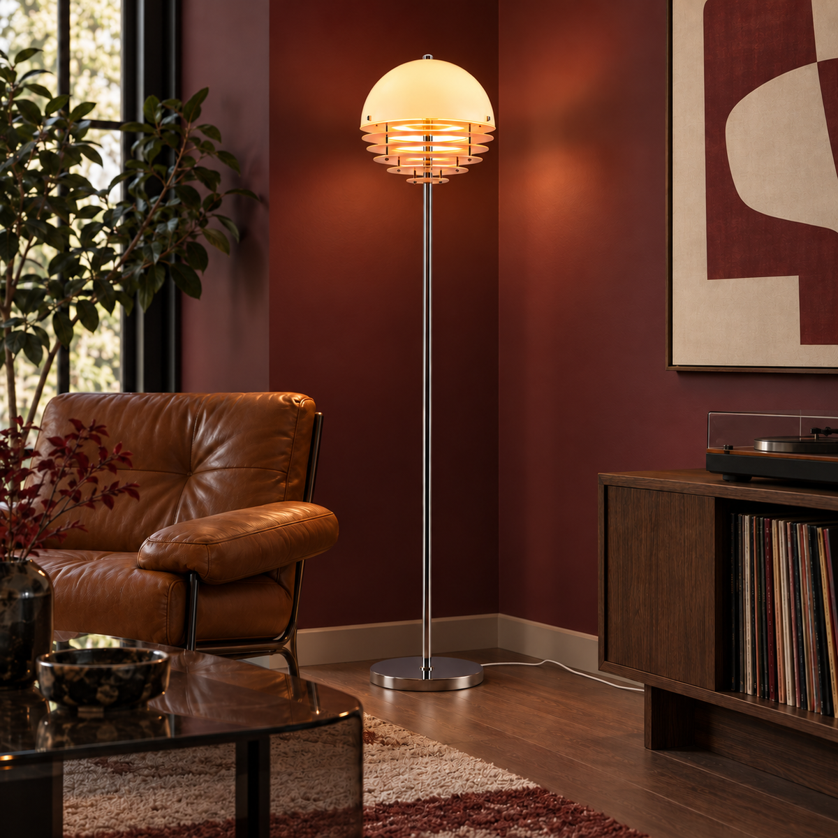 Aperol floor lamp with a white woven cord in a bordeaux room with warm wood and caramel seating.