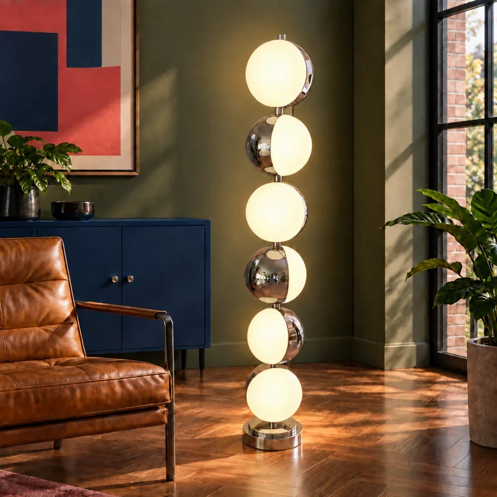 Caviar lamp illuminated in a styled room.