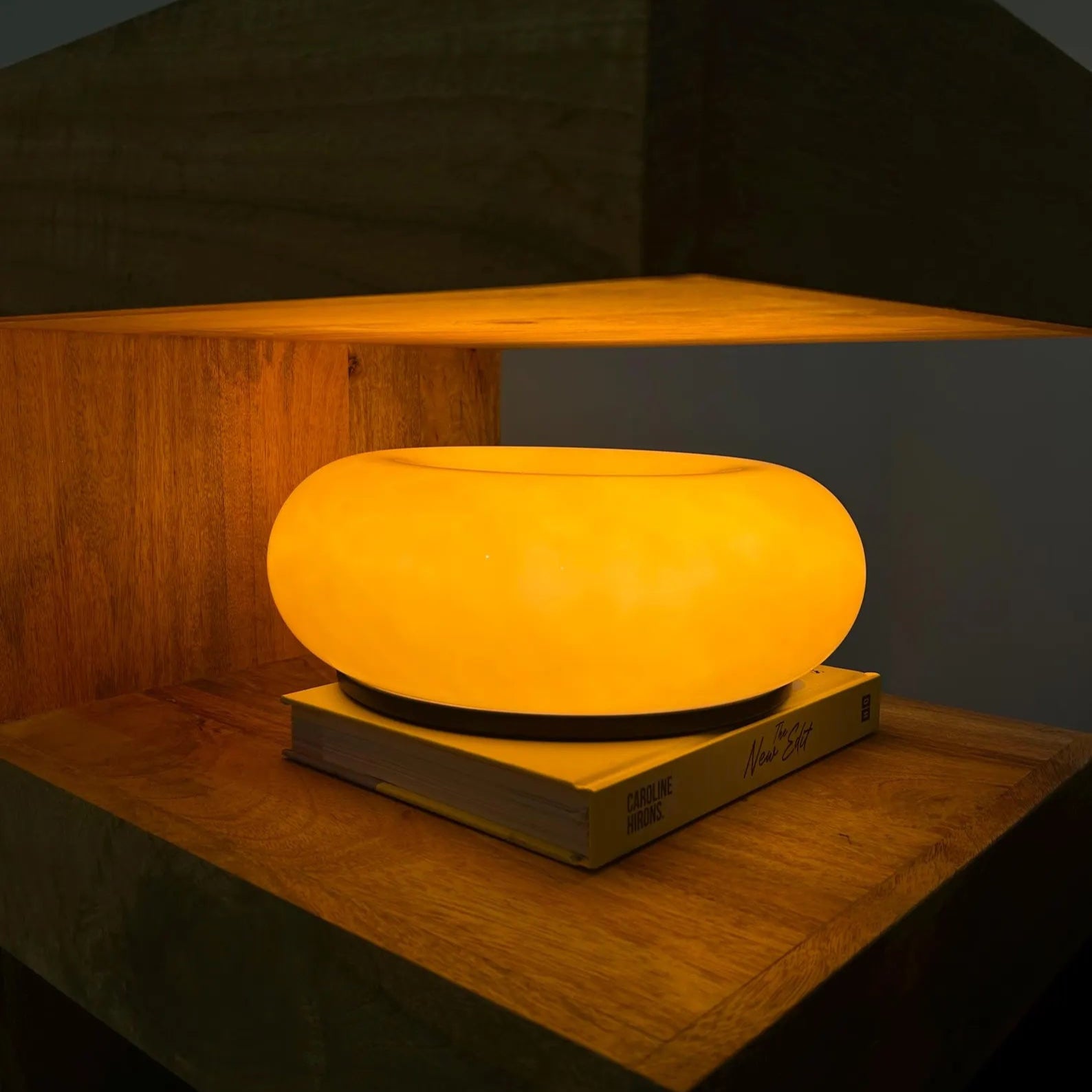 Glownut Lamp pink with warm interior glow illuminating circular opening