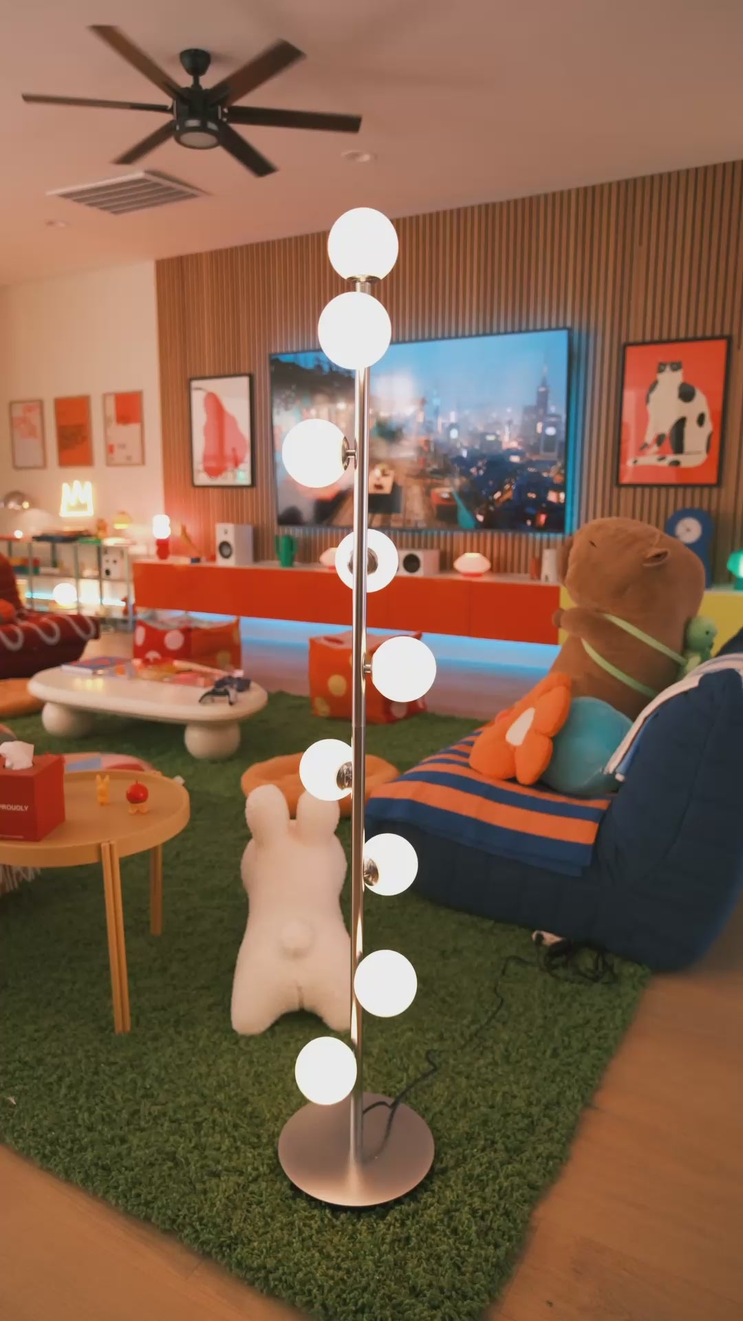 Video of Pearl Floor Lamp Gold showing ambient glow and frosted glass globes by La Caza Cali