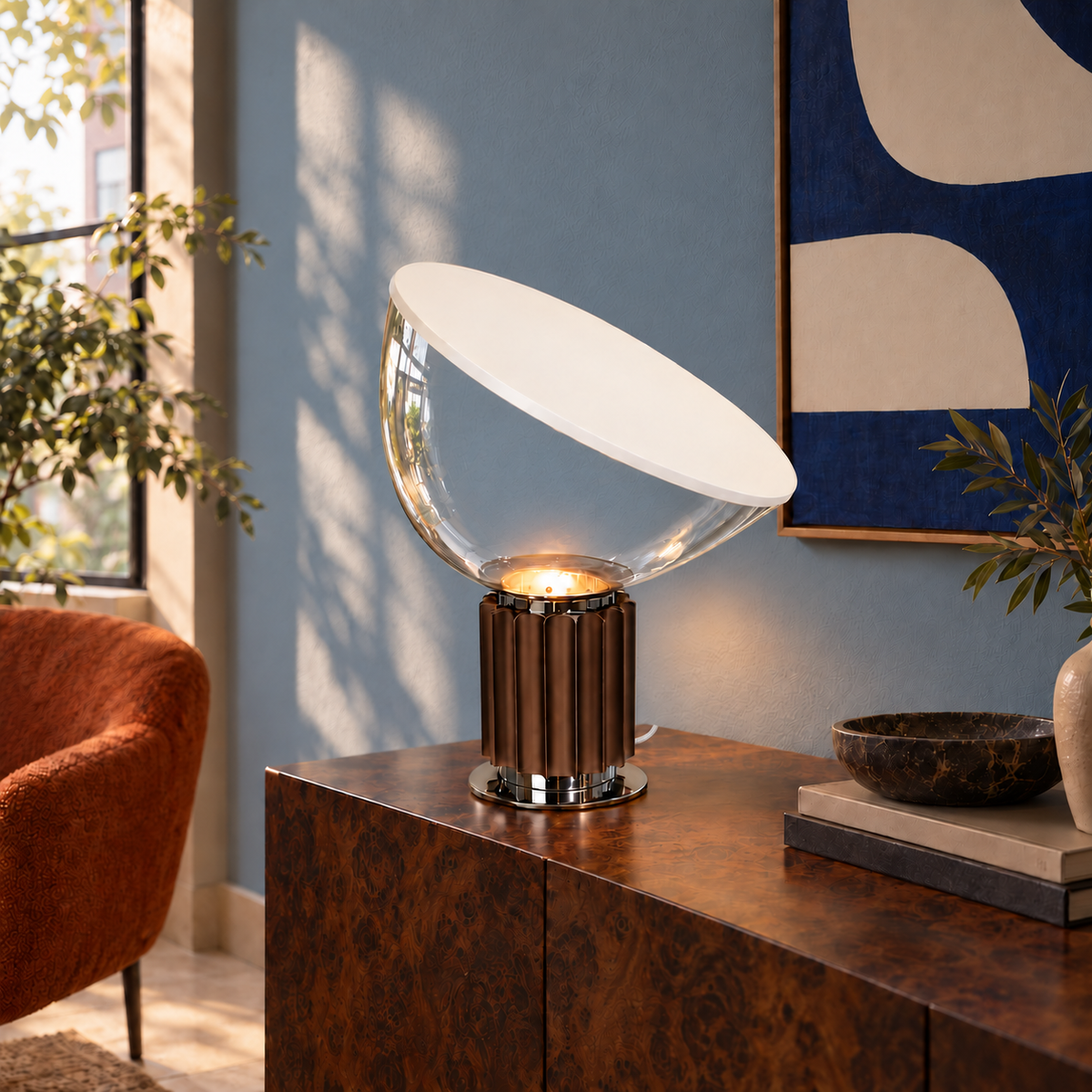 Projekt table lamp with a clear glass bowl and discreet white woven cord on a burl wood console in a blue room.