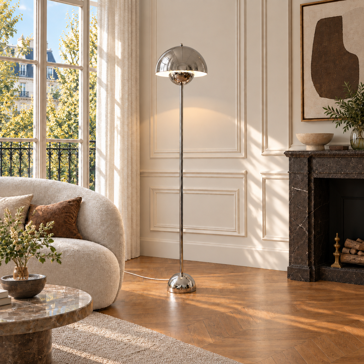 Saturn chrome floor lamp illuminated in a French-style apartment, with a subtle white woven cord.